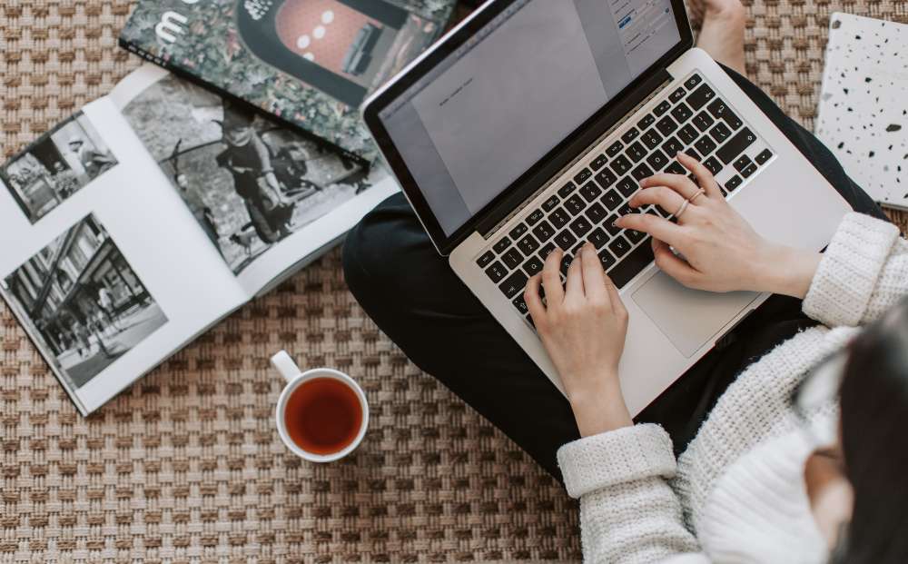 A girl reading an article while having green tea